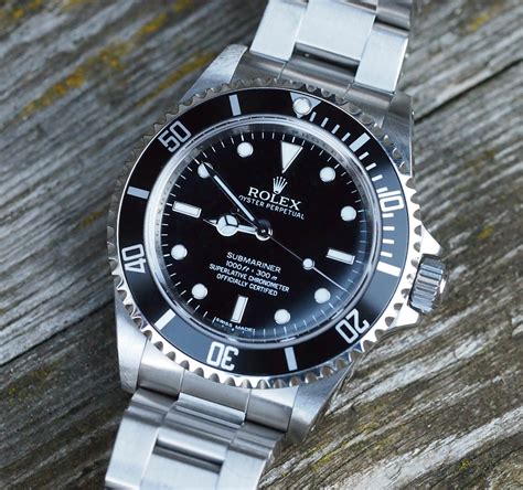 rolex oyster perpetual submariner 14060m|Rolex 14060m review.